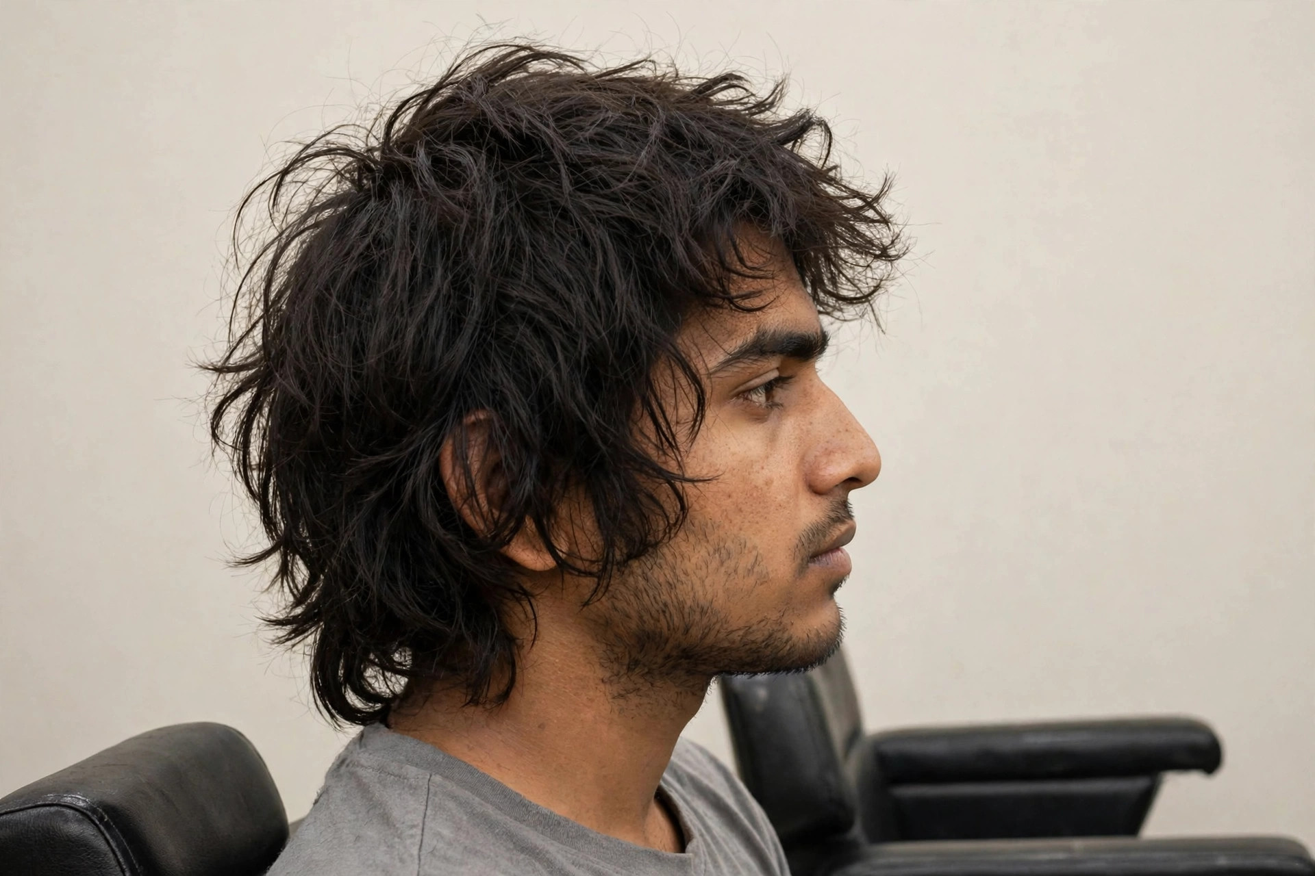 Man with uneven overgrown hair before haircut